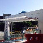 Landmark Metal Panel Glass Railing and Canopy construction